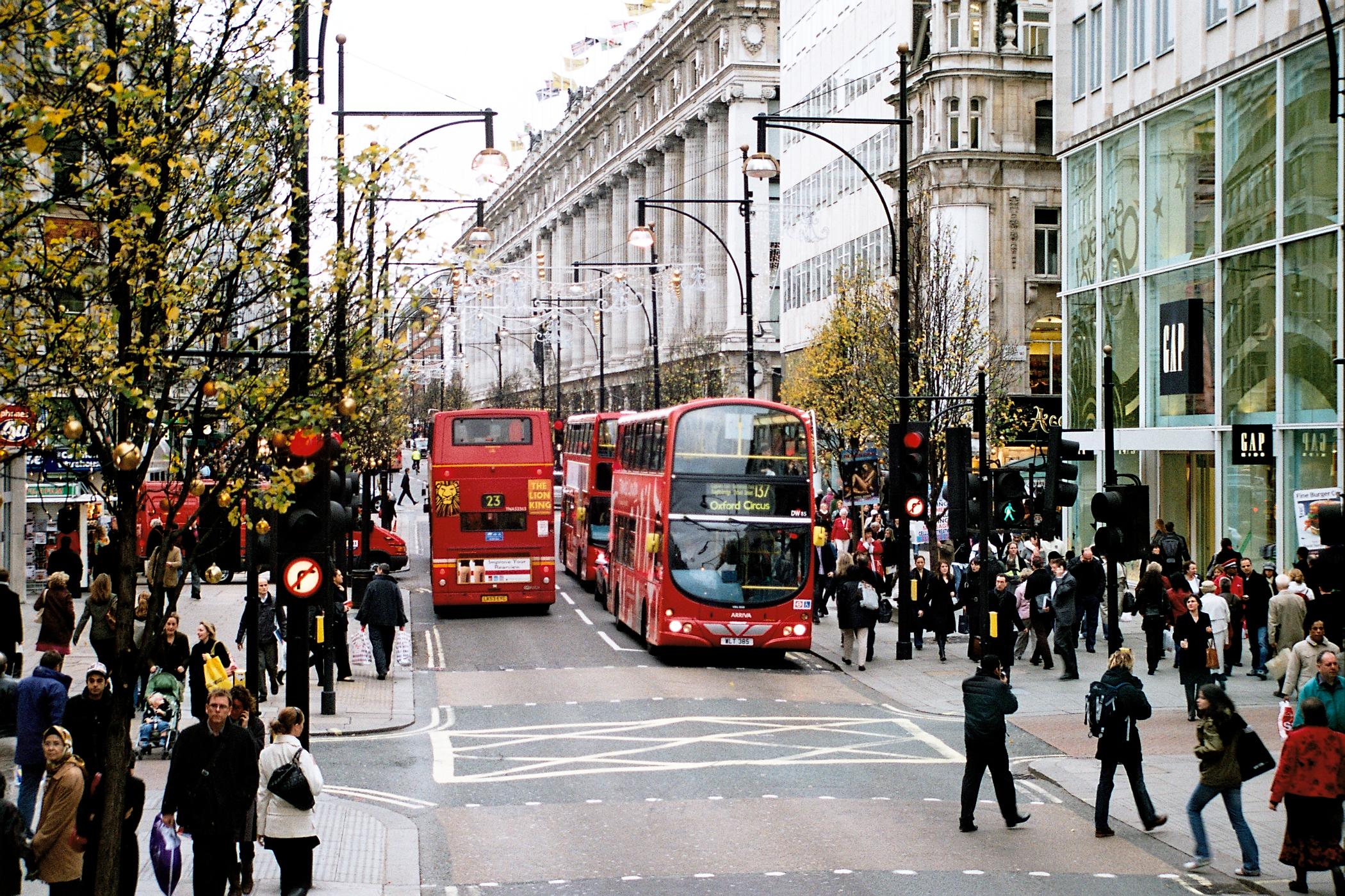 Double-decker buses and shoppers on Oxford Street